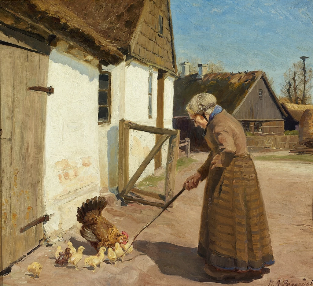 Una gallina con i suoi pulcini